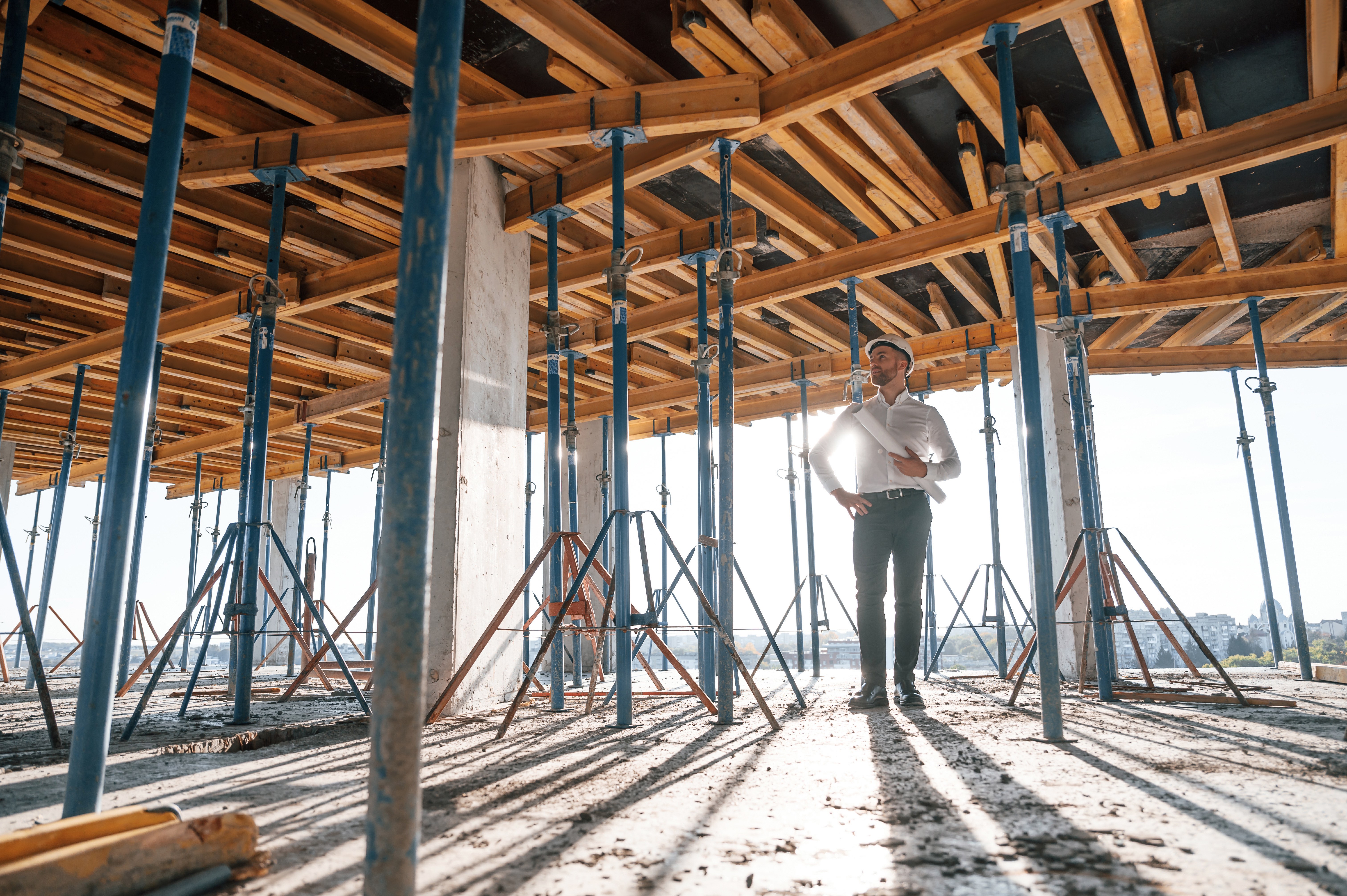 Construction professional with architectural plans